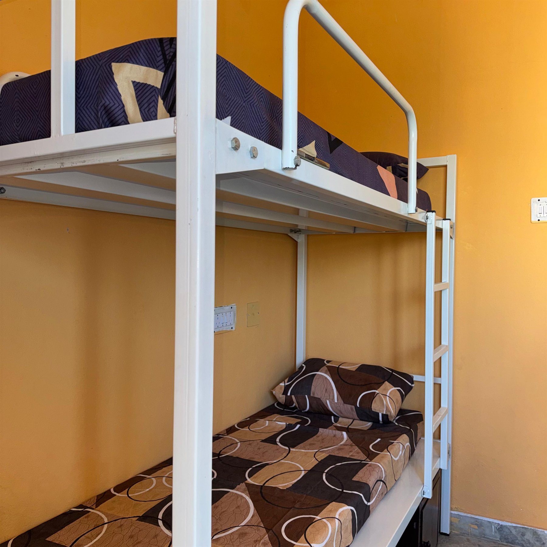 Boys hostel bed and room corner