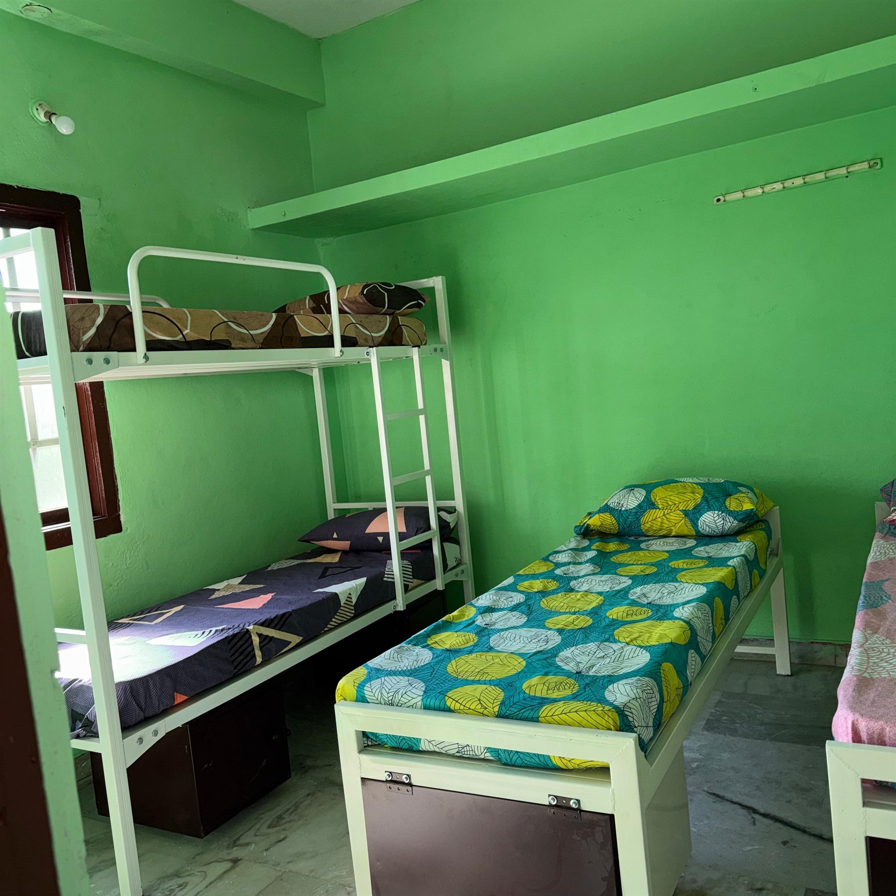 Boys hostel bunk bed and room storage view