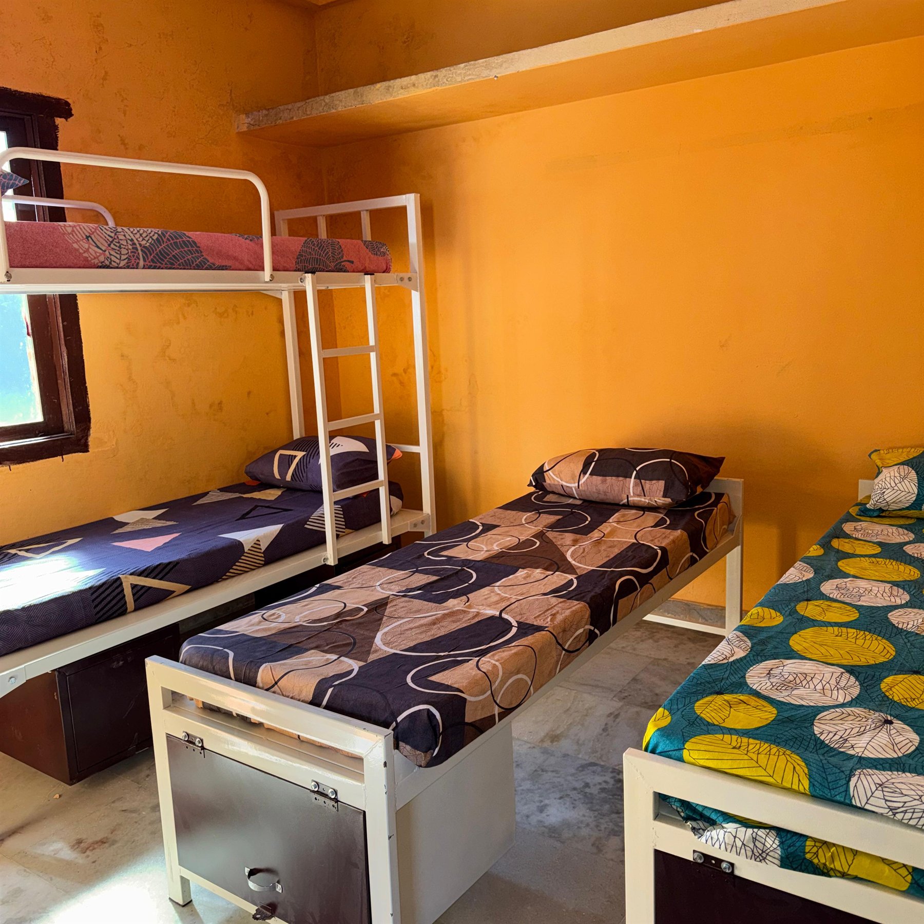 Boys hostel shared room with multiple beds