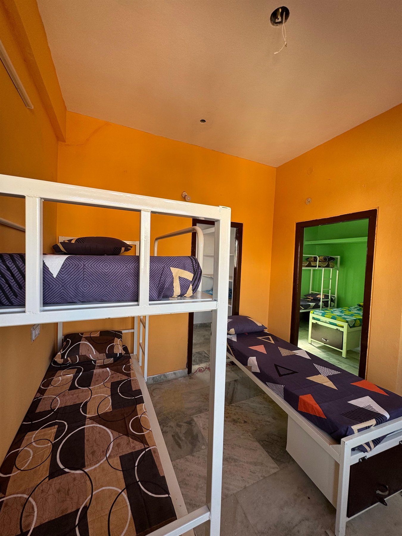 Boys hostel bed with natural light from window